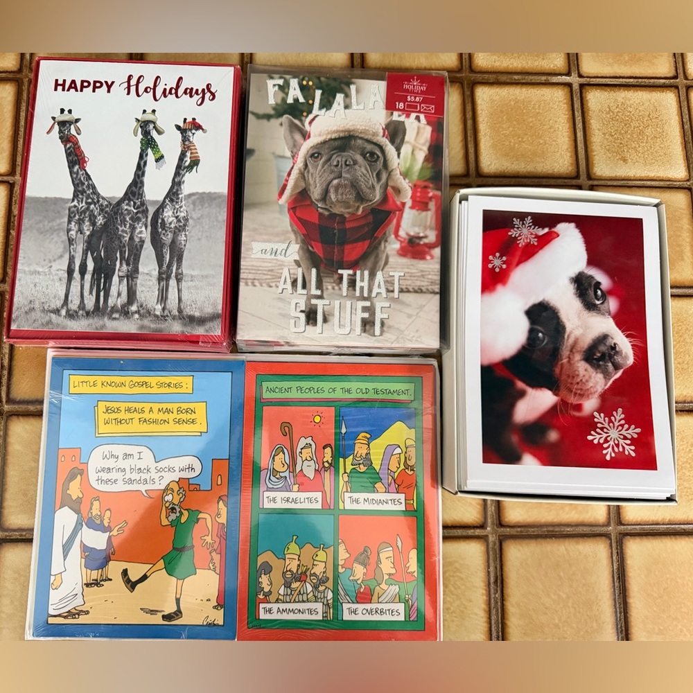 Variety of new Christmas cards, mainly dog and giraffe themed